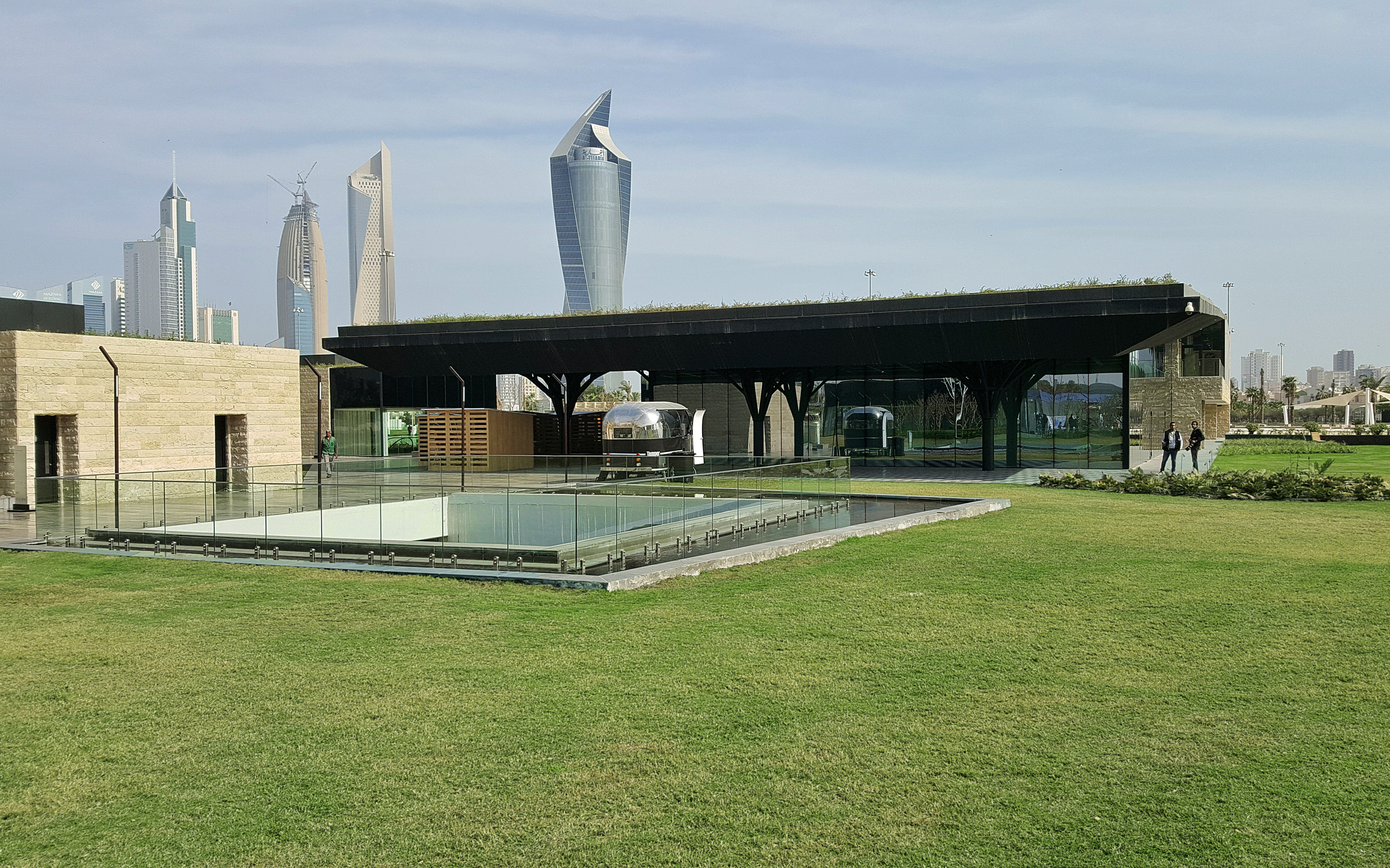The light shaft brings natural light to the garage below. Lawn with large light shaft